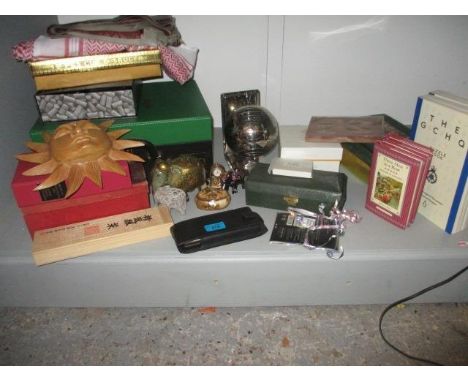 A mixed lot to include books, games, a metal model of a globe, Sarongs, a corkscrew and other items 