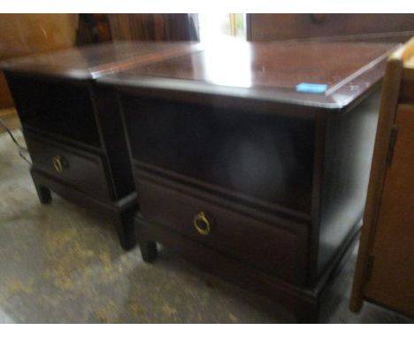 A pair of Stag Minstrel mahogany finished bedside cabinets, with a shelf and a drawer 