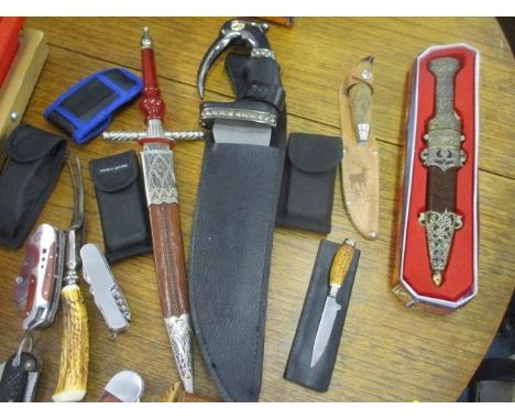 A collection of pocket and other knives and handyman tools 