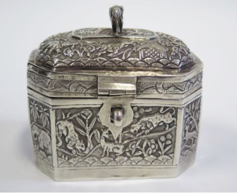 An Indian White Metal Tea Caddy with elephant finial and with repousse animal and foliate decoration, 182g, 10cm long