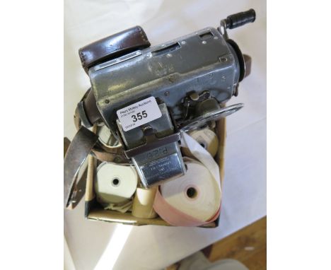 A TIM Bus Conductor's Ticket Machine with leather strap and with tickets