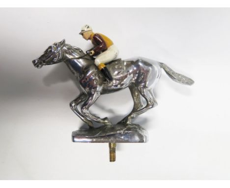 A Chrome and Enamel Car Mascot in the form of a jockey on horse