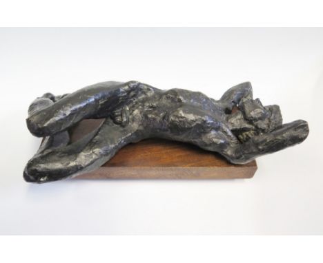 A Bronzed Model of a Recumbent Male Nude on wooden base, 42cm