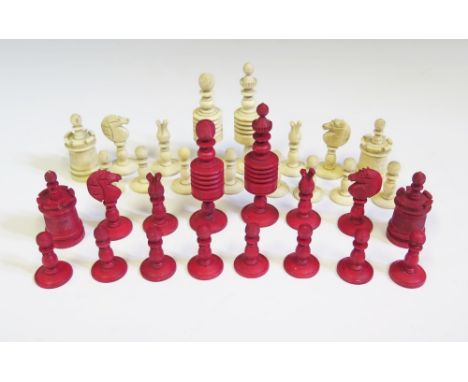 A Nineteenth Century English Carved Bone Chess Set, one side stained red and the other natural, King 8.5cm pawn 3.75cm