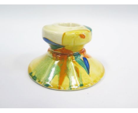 A Clarice Cliff Bizarre Candlestick decorated in a bright freeform pattern, 8.5cm diam