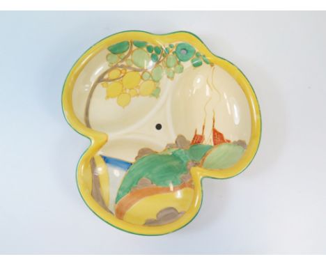 A Clarice Cliff Bizarre Dish separated into three compartments showing a stylised landscape with a pair of cottages with smok