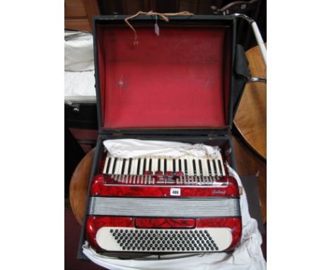 A Galanti Mid XX Century Italian Accordion, with red marbelette casing, in carry case.