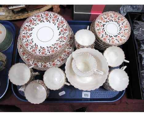 A Tea Service, with floral decoration and gilt highlights, comprising sandwich plate, cake plate, twelve smaller plates, twel