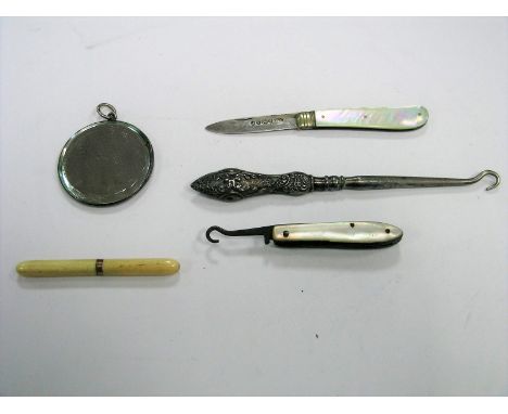 A Victorian Hallmarked Silver and Mother of Pearl Folding Fruit Knife, together with a small mirror, a hallmarked silver hand