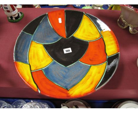 Poole Pottery Charger, with black, blue, red and yellow scaline decoration, 40cm diameter. 