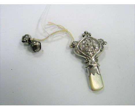 A Continental Style Baby's Rattle, detailed in relief (bells detached), with mother of pearl teether/handle.