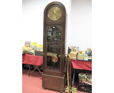 A 1920's Oak Longcase Clock, with dome top, Arabic numerals to circular brass dial, glazed door revealing three weight moveme