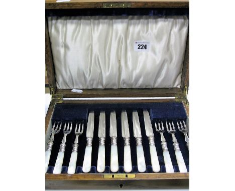 A Wooden Cased Set of Six Mother of Pearl Handled Knives and Forks, stamped "C.W.F" "EP". 