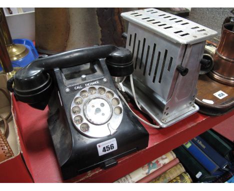 A Circa 1940's Black Bakelite Telephone, with slide tray, model 312F/C57/3A, and a vintage toaster, (untested, sold for parts