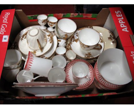 An Early XX Century China Tea Service, with foliate decoration, "Rhine, England" printed on base, comprising cups, etc; toget