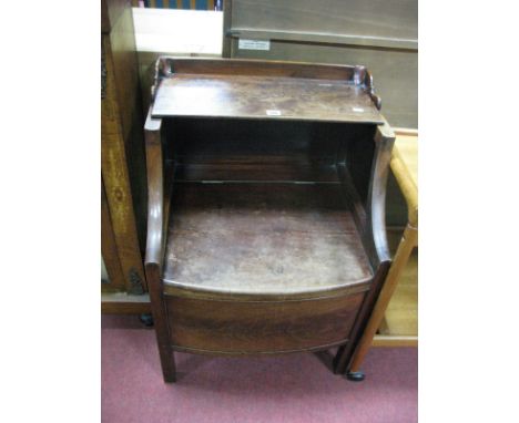 An XVIII Century Mahogany Commode, with shaped gallery and bowed front.