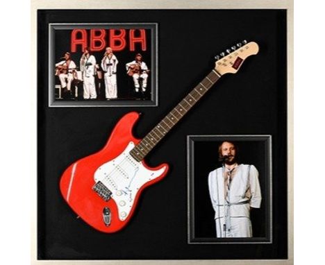 A stunning framed item of ABBA memorabilia which has incorporated within the large box frame a guitar which bears the authent