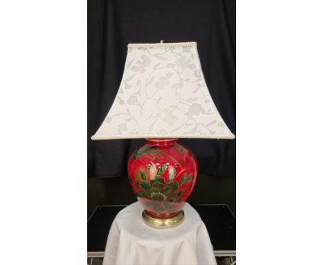 A porcelain red lacquered lamp with bird and flower hand painted detail. Display shade shown supplied free of charge. Conditi