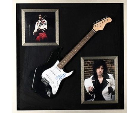 A rare framed guitar which MICK JONES has signed the pick guard and also has signed the words "London Calling The Clash". Not