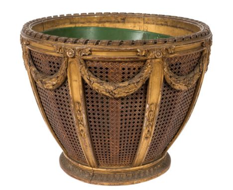A carved giltwood and gesso circular jardiniere:, in the French taste, having a metal liner, the top with spiral ribbon edge,