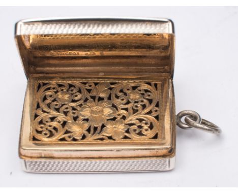 A William IV silver vinaigrette, maker Nathaniel Mills, Birmingham, date letter worn possibly 1831: of rectangular outline, w