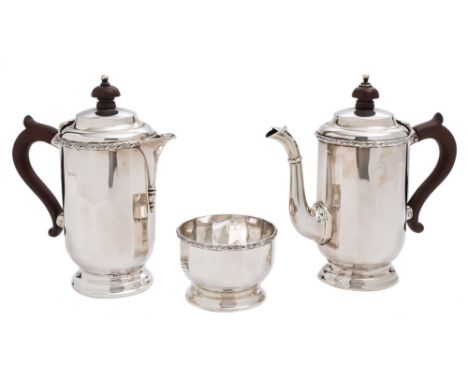 A matched George V silver three-piece tea service, maker William Neale & Son Ltd, Birmingham, 1928/30/32: of polygonal cylind