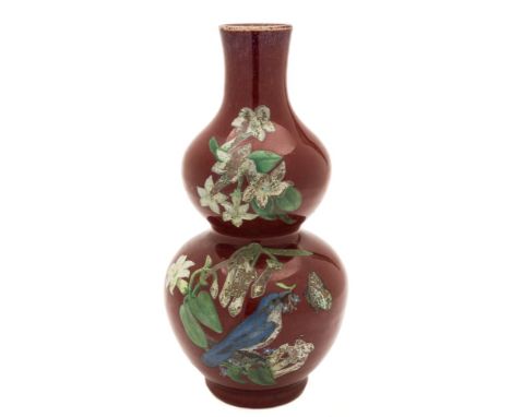 A Chinese 'sang-de-boeuf' double gourd vase and a brown glazed vase: the first later painted with a monogram, a bird, butterf