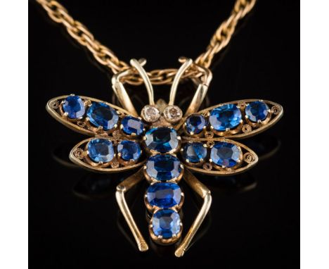 A sapphire mounted insect pendant: set with fourteen graduated oval and cushion-shaped sapphires and two brilliant-cut diamon