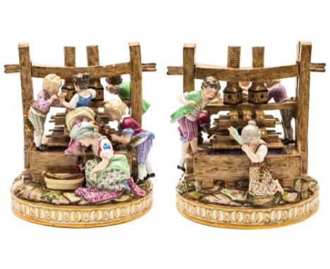 A large Meissen group of the 'The Wine Pressers' : after the original by J.C.Schonheit, with six children around a large wine