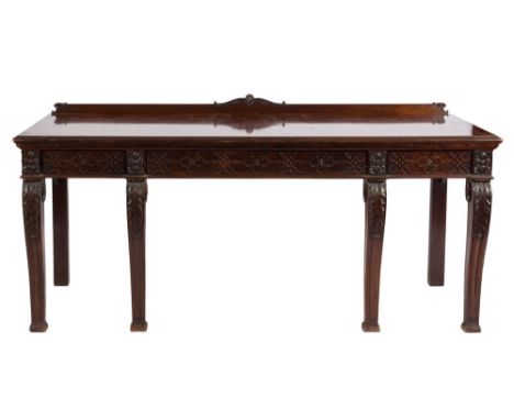 An Edwardian carved mahogany rectangular serving table in the Chippendale taste:, the narrow ledge back decorated with foliag