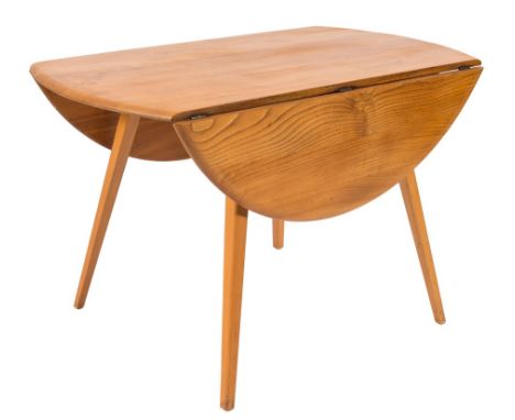 A 1960's Ercol elm and beech oval drop flap dining table:, the hinged top on square section splayed legs, the top 113cm (3ft 