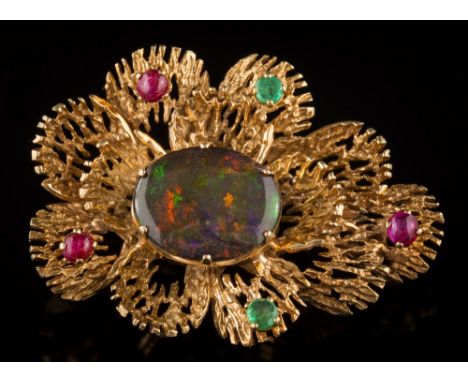 An opal doublet, ruby and emerald mounted brooch: of textured design set with central oval opal doublet, round emeralds and c