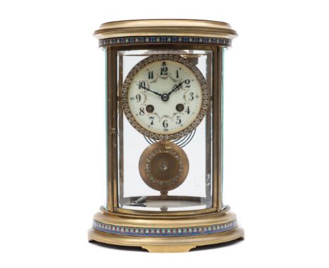 Samuel Marti, Paris, a brass and enamelled oval four glass clock: the eight-day duration movement striking the hours and half