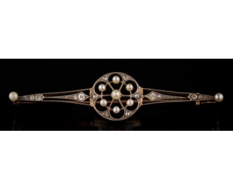 A Belle Epoque diamond, seed pearl and cultured seed pearl bar brooch: the central circular panel millegrain-set with culture