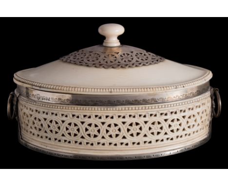 A Victorian ivory and silver mounted casket, maker Edward Brown, London, 1882: of oval outline, with shallow domed lift-off l