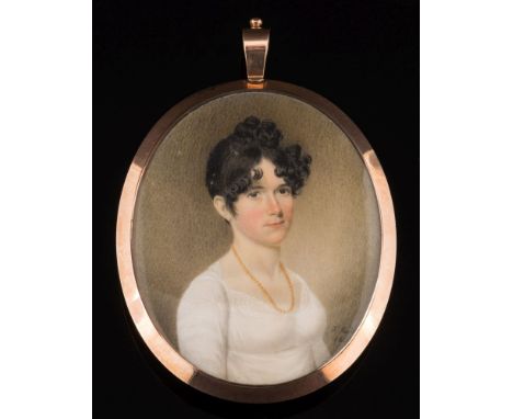 J. Higl***, early 19th Century-A miniature portrait of a young lady,:-bust-length, with dark curling hairwearing an amber bea