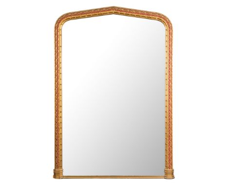 A Victorian Gothic giltwood, gesso and red decorated overmantel mirror of large size: and pointed arch outline, the plate wit