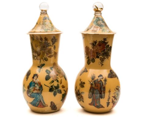 A matched garniture of decalcomania glass vases: interior decorated with coloured prints of figures, birds, butterflies, flow