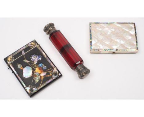 A Victorian mother-of-pearl card case: of rectangular outline, with velvet lined interior, 11cm. wide, a black lacquered and 