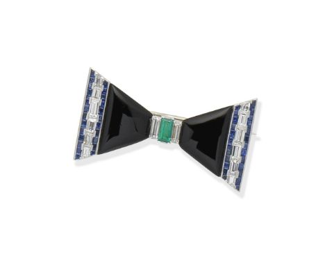 Gem-set bow broochSet with onyx panels, baguette-cut diamonds, calibré-cut sapphires and a central step-cut emerald, width 4.