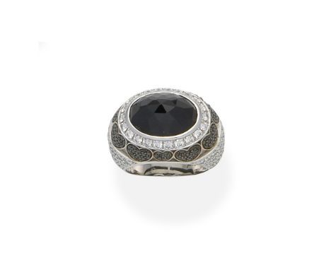Chopard: Sapphire and Diamond RingOf bombé design, set with a rose-cut sapphire, brilliant-cut diamonds and treated black dia