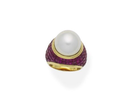 Ruby and cultured pearl dress ringThe 13.0mm cultured pearl in a bombé mount of calibré-cut rubies in concealed settings, rin