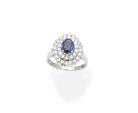 Sapphire and Diamond Cluster RingThe oval-cut sapphire within a double surround of brilliant-cut diamonds, diamonds approx. 0