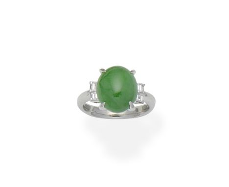 Jade and diamond RingSet with an oval jade cabochon, between step-cut diamond shoulders, ring size approx. KFootnotes:Accompa