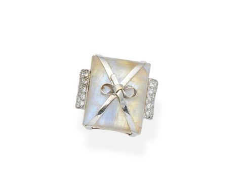 Gem-set dress ringSet with a rectangular cabochon feldspar with applied ribbon decoration, between shoulders pavé-set with br