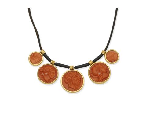 Coral necklace and a bangle1st: The leather cord suspending five coral corallium rubrum discs, carved to depict classical fig