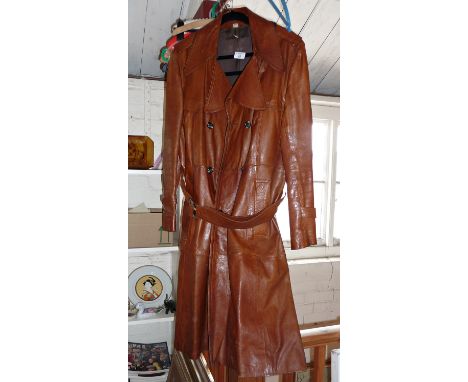 Vintage clothing: 1970s man's brown leather overcoat together with matching suitcase