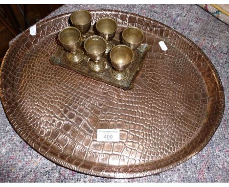 Arts &amp; Crafts beaten copper tray by Joseph Sankey &amp; Sons and a tray of six Indian brass egg cups