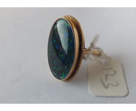 9ct. oval opal set ring, size Q 5.2g.      