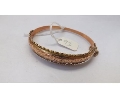  9ct. engraved hinged bangle with galleried edges 7.5g.  